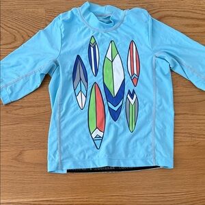Coolibar Kids Rashguard - Aqua with Surfboard Design
